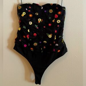 Strapless floral bodysuit. Boutique brand. Size medium. NWOT. Side zipper.